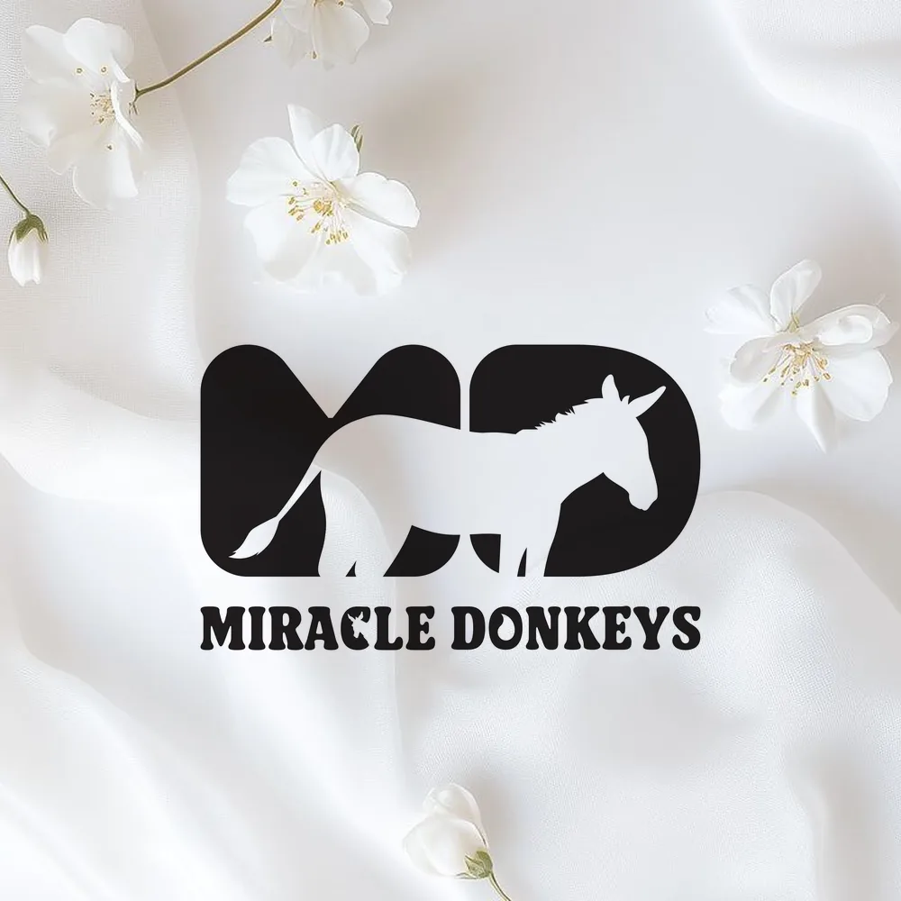 Miracle Donkeys logo on white silk with white flowers